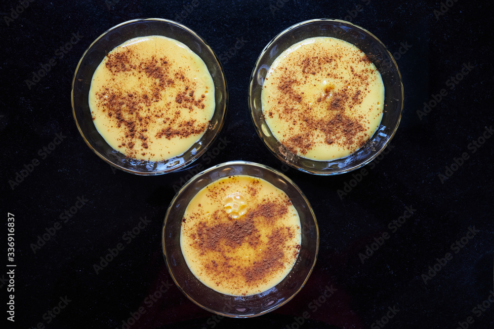 3 vanilla custard triangle on black background 3 vanilla custard triangle on black background