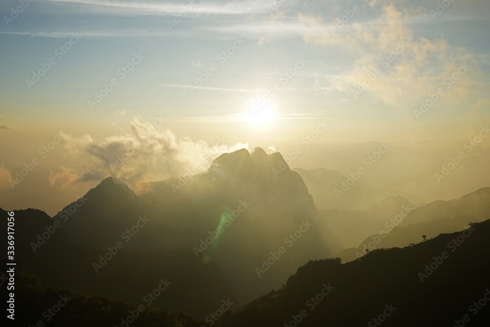 Natural landscape of Rocky green mountain range with cloudy sky view