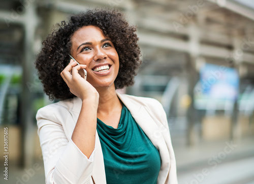 Happy businesswoman talking on the phone