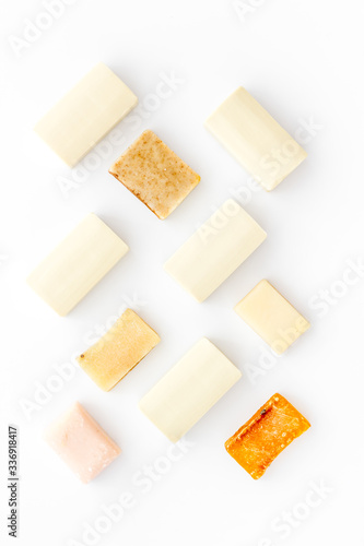 Soap bars flat lay on white background top-down pattern