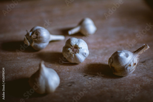 five heads of garlic on the kitchen table