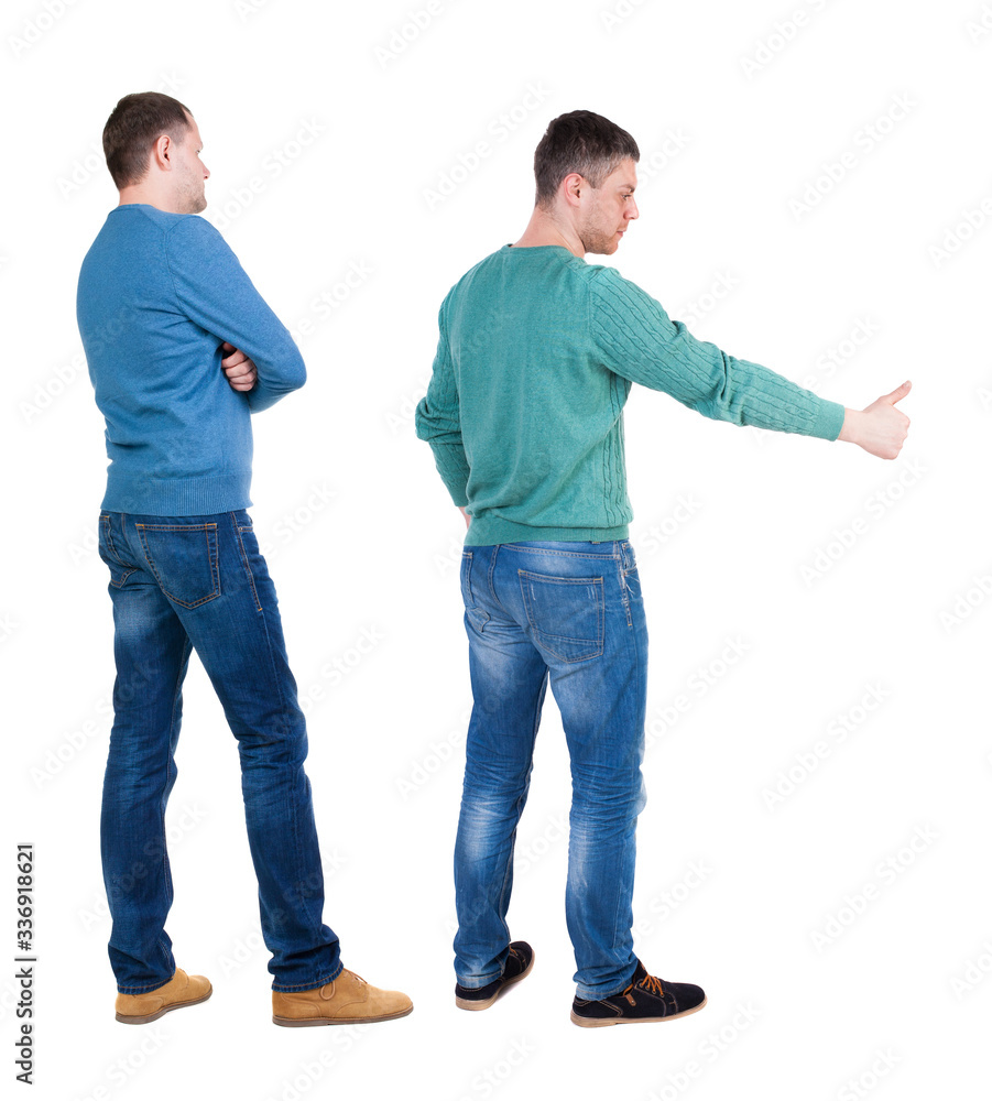 Back view two man in sweater showing thumb up. Back view two man in sweater showing thumb up.