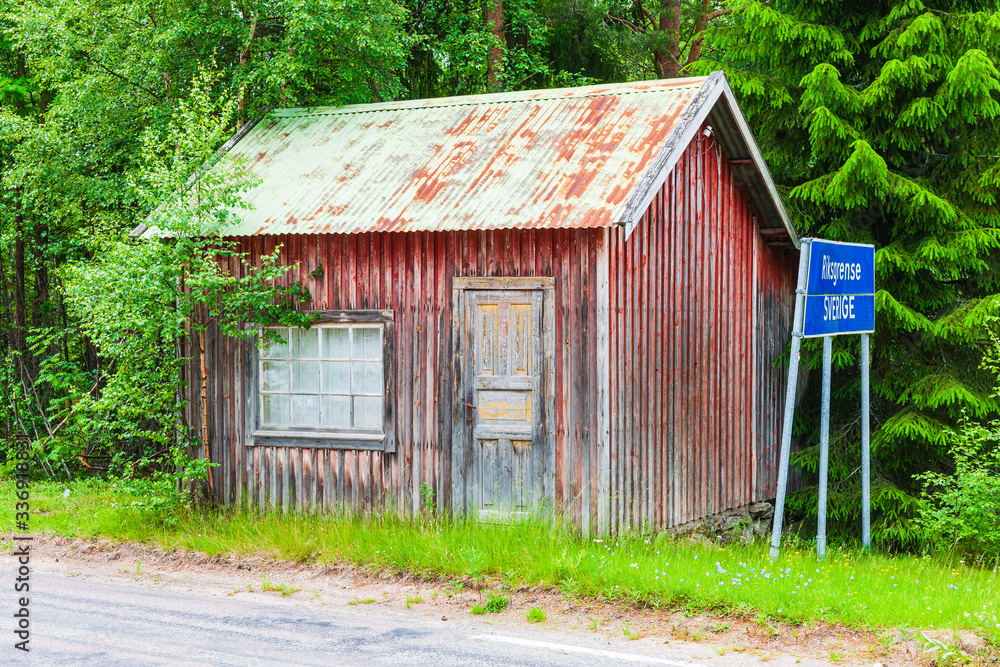 Old red building at cross border between Sweden and Norway.