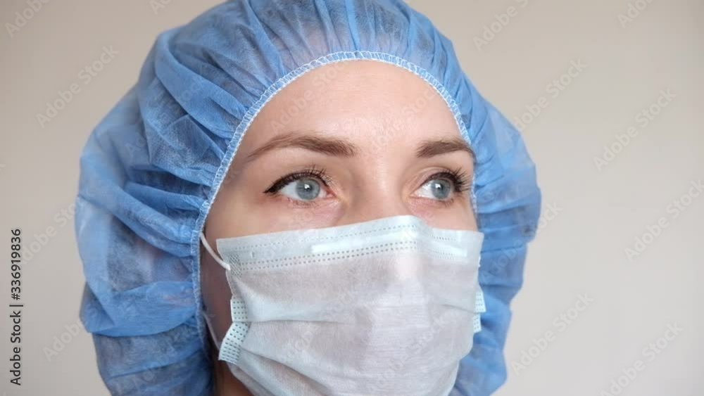 A doctor in a medical mask and protective suit against covid-19. A doctor in a medical mask and protective suit against covid-19.