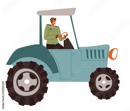 Man riding tractor working on field, farming male