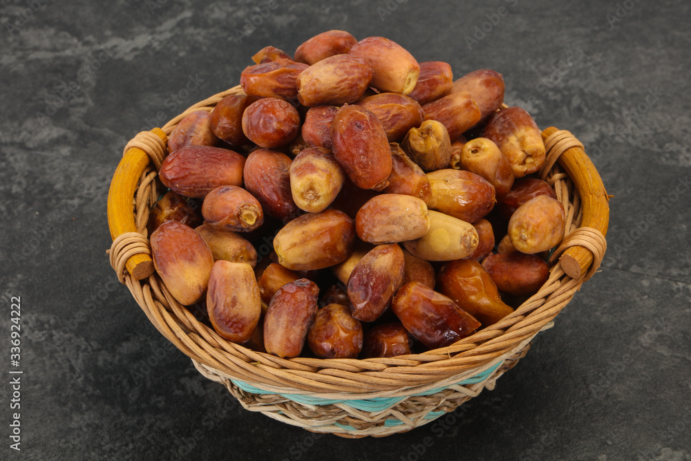 Sweet tasty dry dates in the basket Sweet tasty dry dates in the basket
