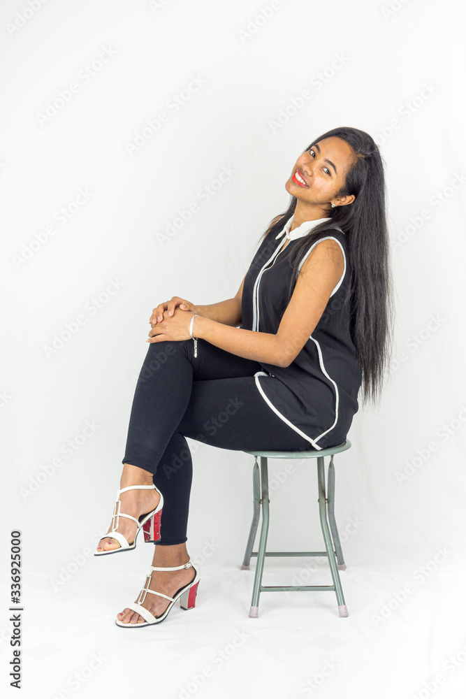 A young mixed race woman dressed in classic style A young mixed race woman dressed in classic style