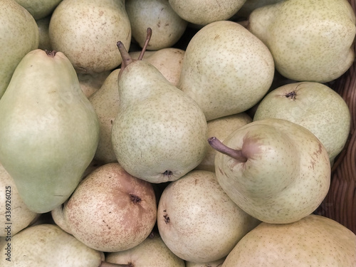 Pear texture: many pears collected in bunkers during harvest at the production stage
