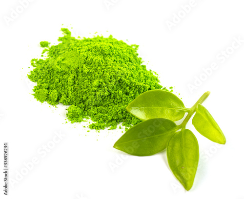 dry green tea powder matcha tea with whole leaves, isolate on a white background