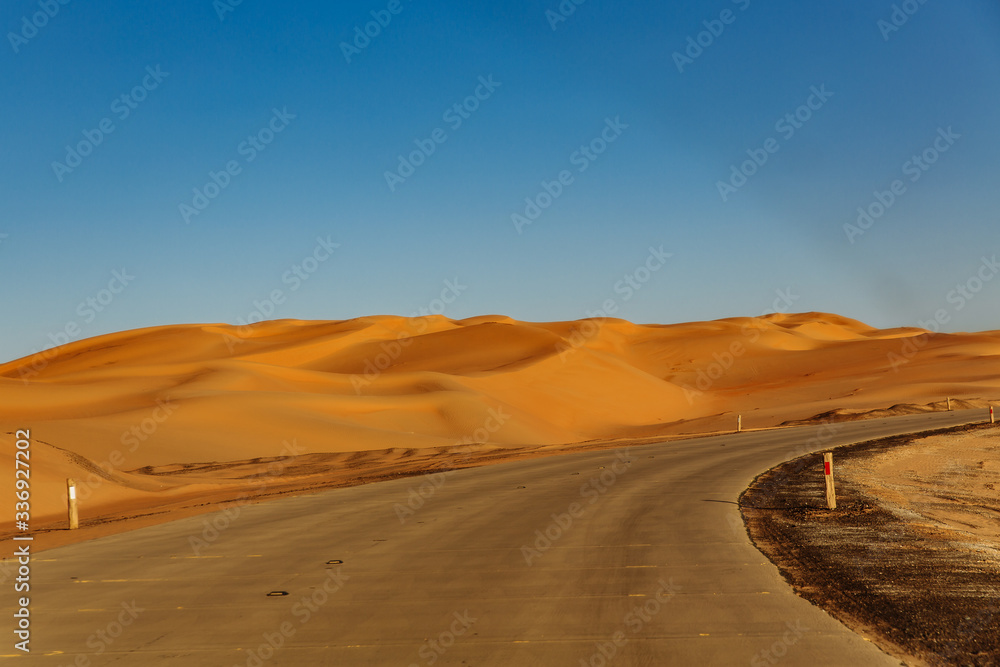 Road through the desert to the Moreeb dune in Liwa Oasis, Emirate of Abu Dhabi, UAE Road through the desert to the Moreeb dune in Liwa Oasis, Emirate of Abu Dhabi, UAE