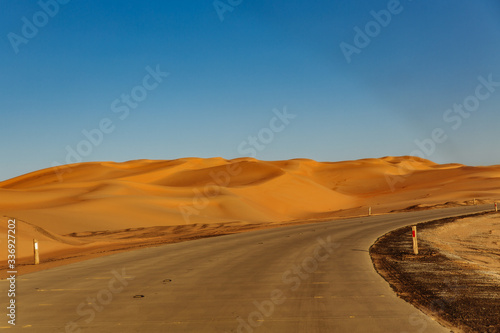 Road through the desert to the Moreeb dune in Liwa Oasis, Emirate of Abu Dhabi, UAE