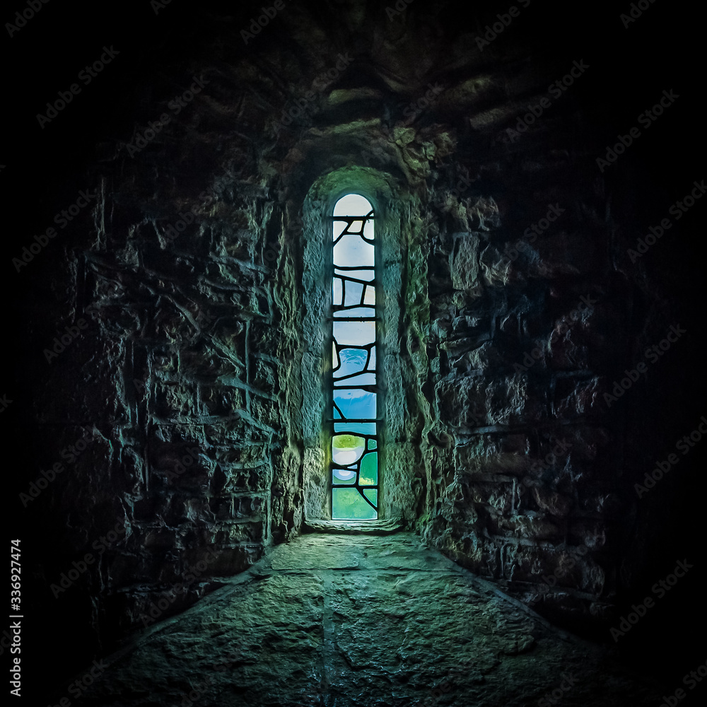 Stained glass window behind the altar of Saint Aldhelm Chapel, St Albans Head near Worth Matravers, Dorset, UK
