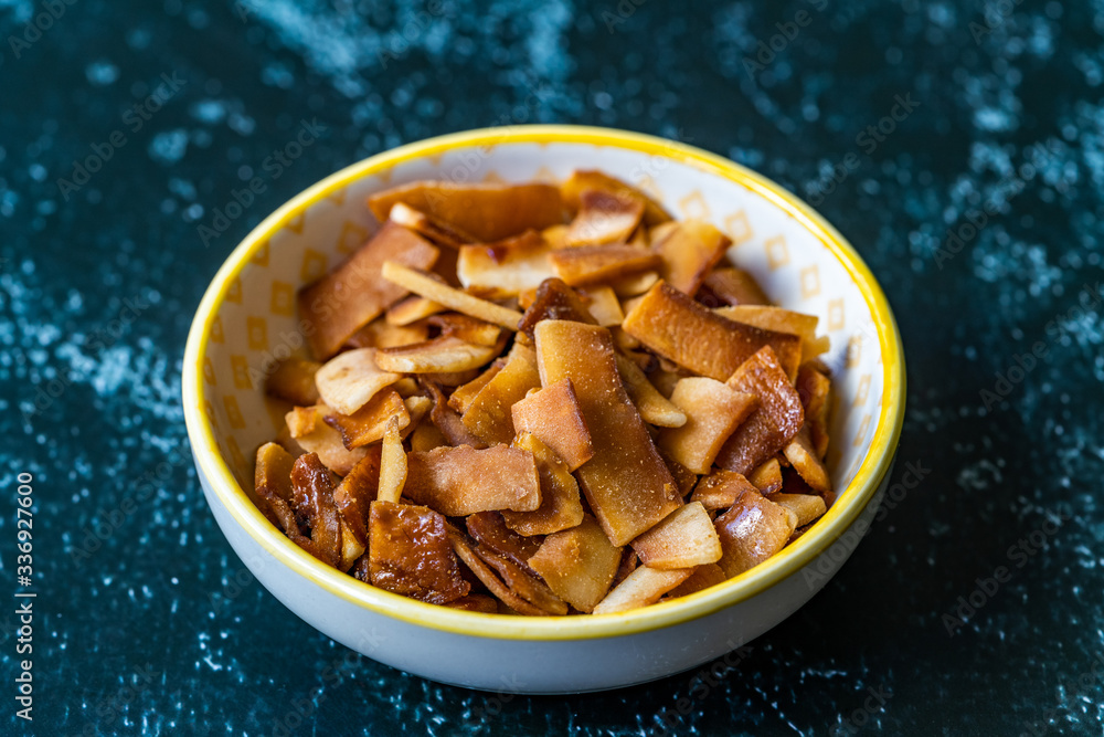 Healthy Organic Roasted Coconut Chips with Caramel Flavor / Caramelized Snacks. Healthy Organic Roasted Coconut Chips with Caramel Flavor / Caramelized Snacks.