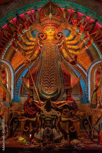 Idol of Goddess Devi Durga at a decorated puja pandal in Kolkata, West Bengal, India. Durga Puja is a popular and major religious festival of Hinduism that is celebrated throughout the world.