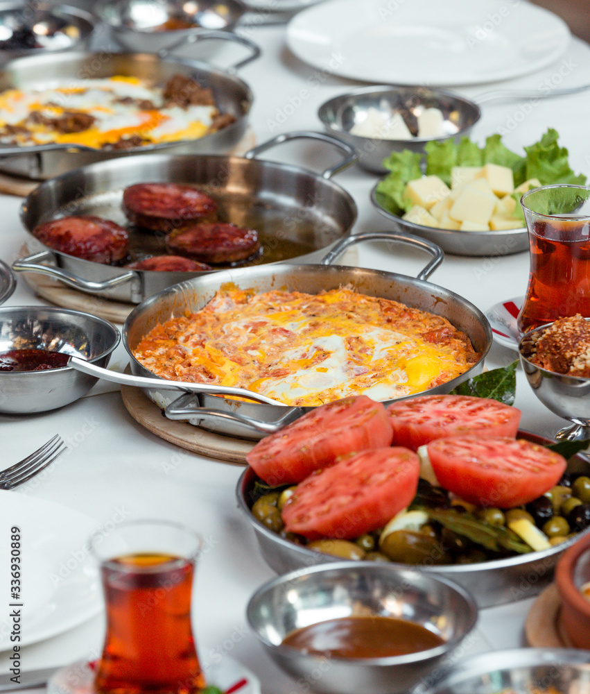 scrambled eggs with tomatoes and fried sausages scrambled eggs with tomatoes and fried sausages