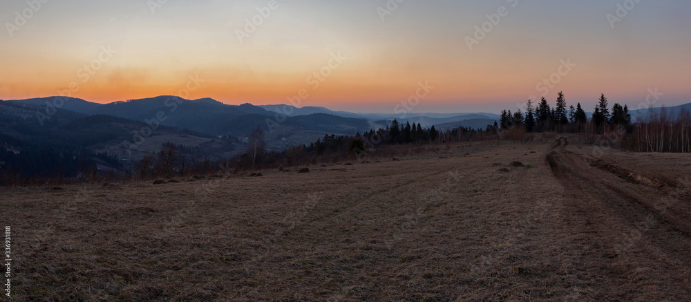 The Carpathian mountain landscape, the Beskid region. Twilight in the Carpathians. Banner format. Landscape of the evening Carpathians. Wonderful Carpathian mountain landscape. 