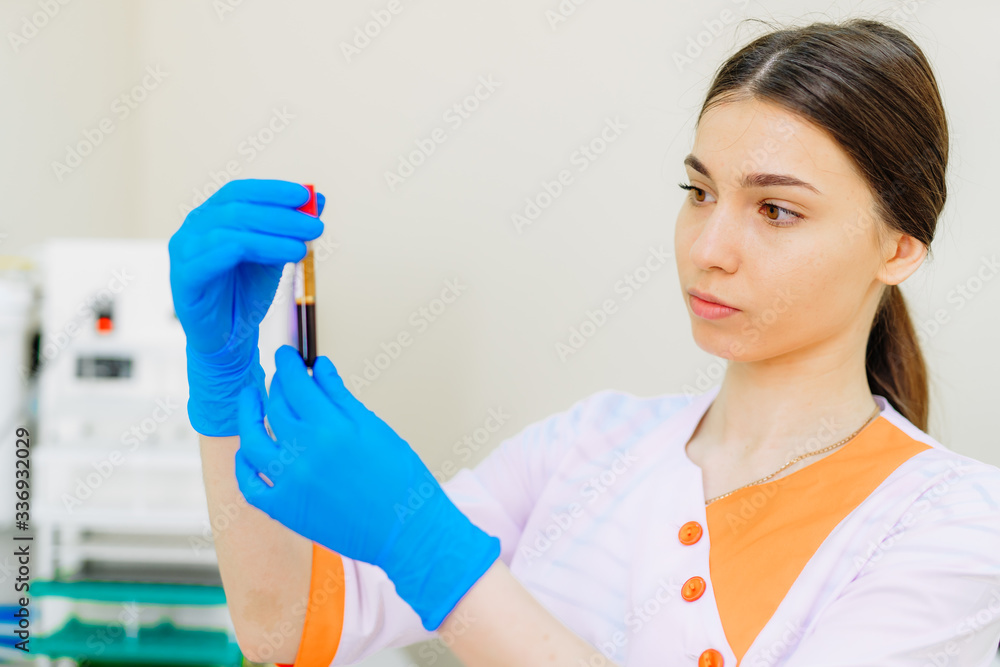 Blood samples for research in microtubes. Testing in laboratory. Nurse holding blood test tubes. Chemical research. Prevention. Pneumonia diagnosing. COVID-19 and coronavirus identification. Pandemic. Blood samples for research in microtubes. Testing in laboratory. Nurse holding blood test tubes. Chemical research. Prevention. Pneumonia diagnosing. COVID-19 and coronavirus identification. Pandemic.