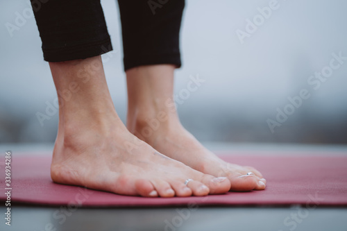 Close up detail of womans feet during yoga exercise. © teksomolika