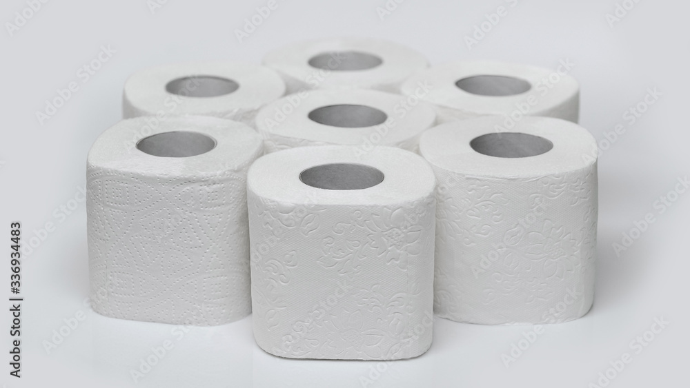 Rolls of toilet paper on a white background. Outbreak of the coronavirus concept COVID-19. Coronavirus - 2019-nKoV. Stay at home while in quarantine. Rolls of toilet paper on a white background. Outbreak of the coronavirus concept COVID-19. Coronavirus - 2019-nKoV. Stay at home while in quarantine.