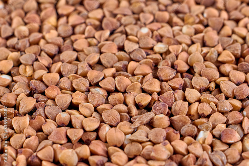 Macro photo of food buckwheat groats. Buckwheat grain background texture Macro photo of food buckwheat groats. Buckwheat grain background texture