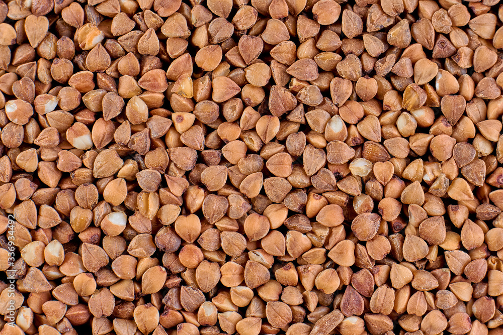 Macro photo of food buckwheat groats. Buckwheat grain background texture Macro photo of food buckwheat groats. Buckwheat grain background texture