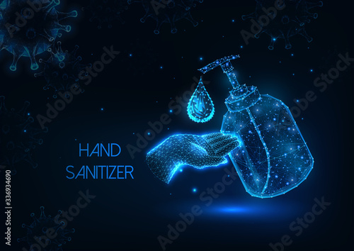 Futuristic glowing hand sanitizing concept with alcohol gel bottle, liquid drop and human hand