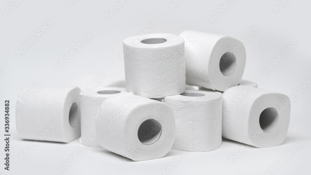 Rolls of toilet paper on a white background. Outbreak of the coronavirus concept COVID-19. Coronavirus - 2019-nKoV. Stay at home while in quarantine. Rolls of toilet paper on a white background. Outbreak of the coronavirus concept COVID-19. Coronavirus - 2019-nKoV. Stay at home while in quarantine.