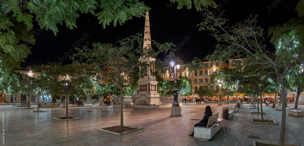 Plaza de la Merced Square at night in central Málaga, Spain.