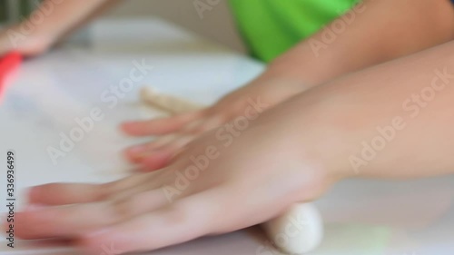 Wallpaper Mural indoor portrait of young happy caucasian childs playing with play dough Torontodigital.ca