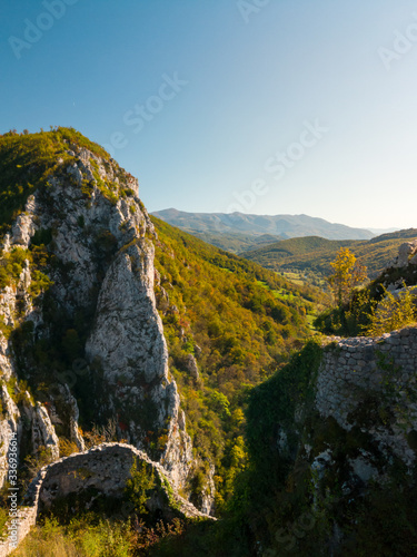 View from the walls of the old town of Kljuc above the right bank of the Sana River on the gorge between the Breščica Mountain and the Ljubinska Mountain where the Sana River flows. photo