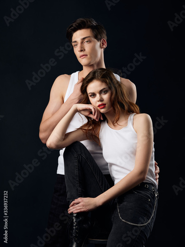 Woman and man against a dark background married couple