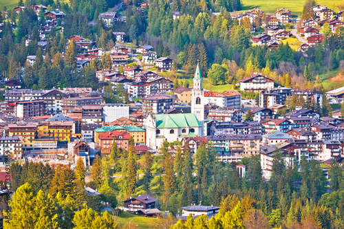 Town of Cortina d' Ampezzo in green landscape of Dolomites Alps photo