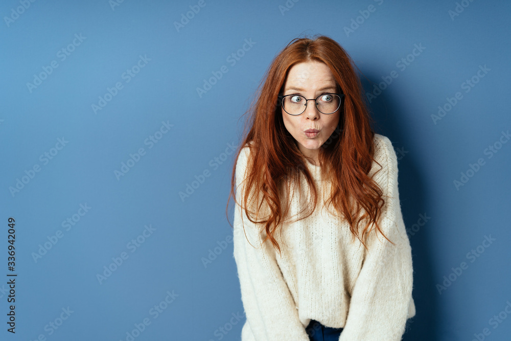 Fototapeta premium Apprehensive young woman staring to the side