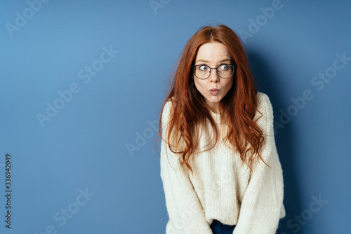 Apprehensive young woman staring to the side photo