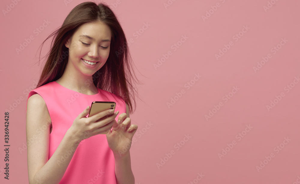 Pretty blonde girl pays for online purchases in a mobile phone, after adding a card to the app. Payment by credit card. Pretty blonde girl pays for online purchases in a mobile phone, after adding a card to the app. Payment by credit card.