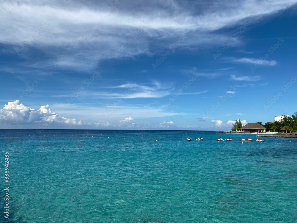 Landscape.Look at the horizon in the open sea from the shore.Beautiful natural background.Line horizon of the blue ocean and sky with clouds.Horizontal, free space, nobody.Concept of natural beauty. Landscape.Look at the horizon in the open sea from the shore.Beautiful natural background.Line horizon of the blue ocean and sky with clouds.Horizontal, free space, nobody.Concept of natural beauty.