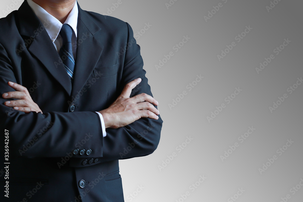 Business man with cross arm on gray background. Business man with cross arm on gray background.