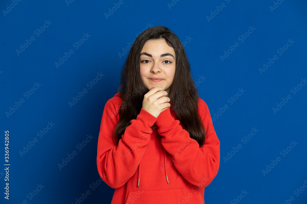 Brunette young girl wearing red jersey Brunette young girl wearing red jersey