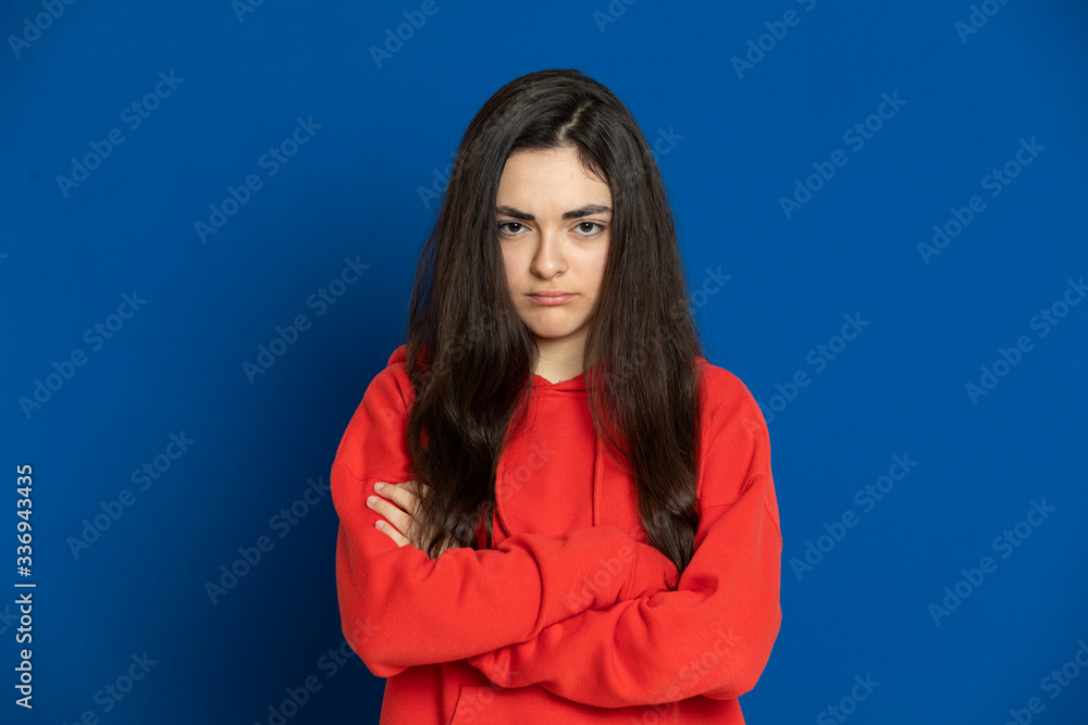 Brunette young girl wearing red jersey Brunette young girl wearing red jersey