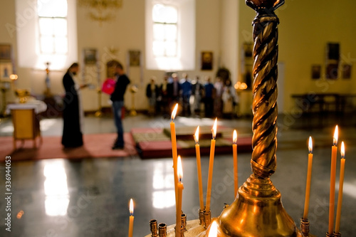 candles at the baptismal ceremony in the orthodox church Fototapet