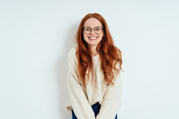 Smiling friendly young woman wearing spectacles