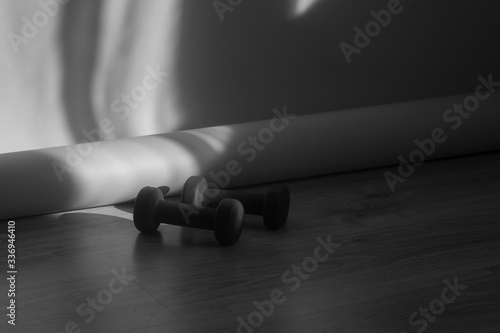 Healthy background fitness equipment, Dumbbell on wooden floor. Healthy lifestyle, sport concept. Black and white filter