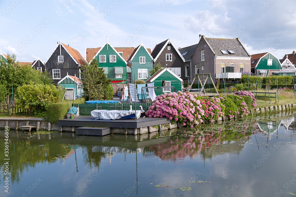 Obraz premium Typical Dutch village scene with wooden houses on the island of Marken in the Netherlands, Holland