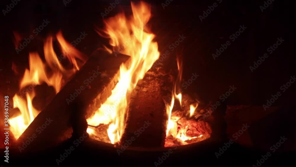 Close up of wood burning in romantic glowing fireplace, real time Close up of wood burning in romantic glowing fireplace, real time