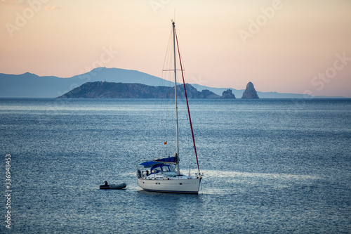 Canvas Print A sailboat at sunset in the mediterranean sea in front of Begur, Catalonia, Spai