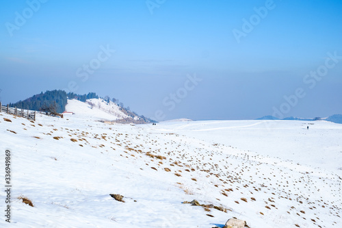Fototapeta Naklejka Na Ścianę i Meble -  sun over the winter mountains with snow, Cindrel mountains, Paltinis, Romania