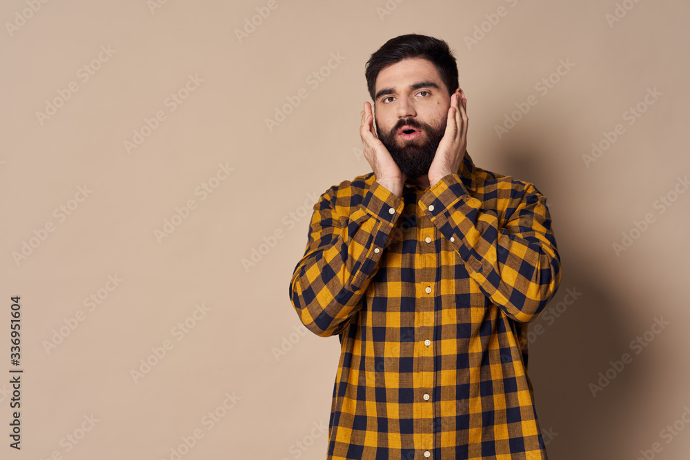 young man with a beard and glasses young man with a beard and glasses