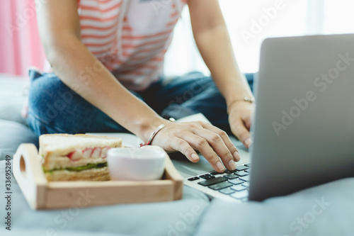 Woman using computer and ha...
