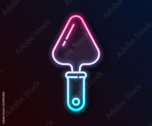 Glowing neon line Trowel icon isolated on black background. Vector Illustration