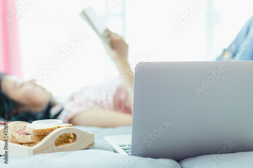 Blurred woman reading a boo...